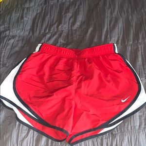 red nike shorts
